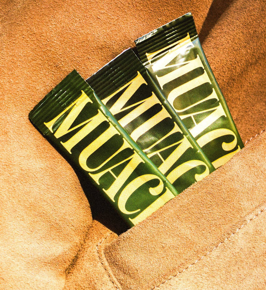 Stick packs tucked into a suede jacket pocket