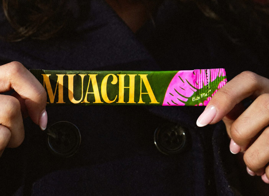 Hands holding a Muacha stick pack
